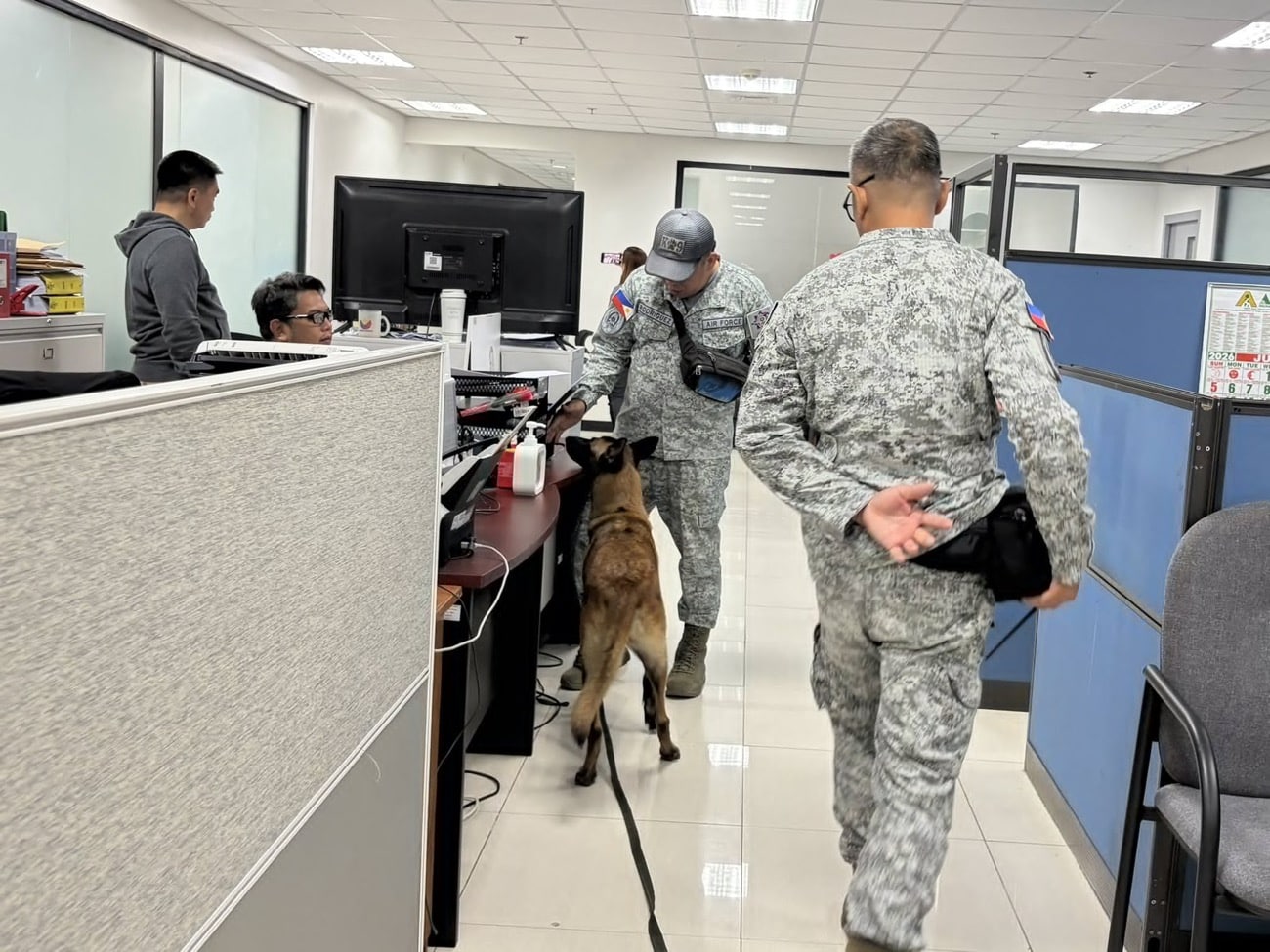 LOOK: PAF K9 units inspect NBI office after EID found near DOJ, Senate